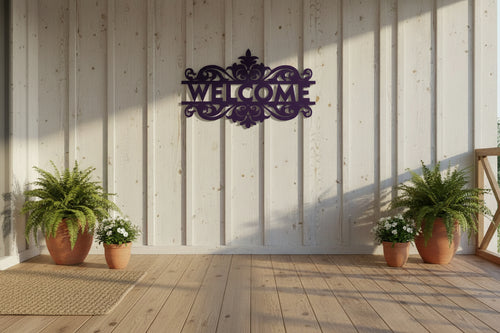 Decorative metal welcome sign with intricate designs.